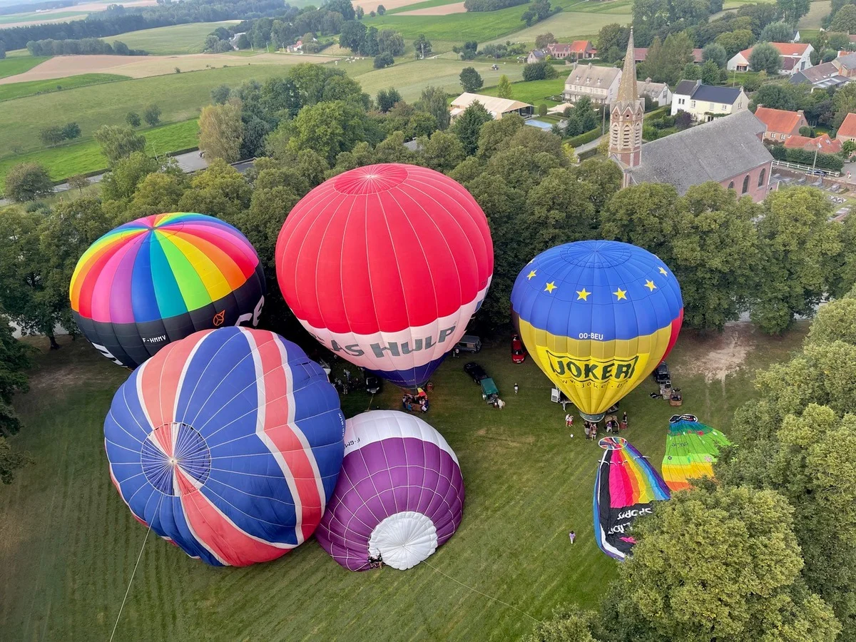 Hot air balloons above the countryside