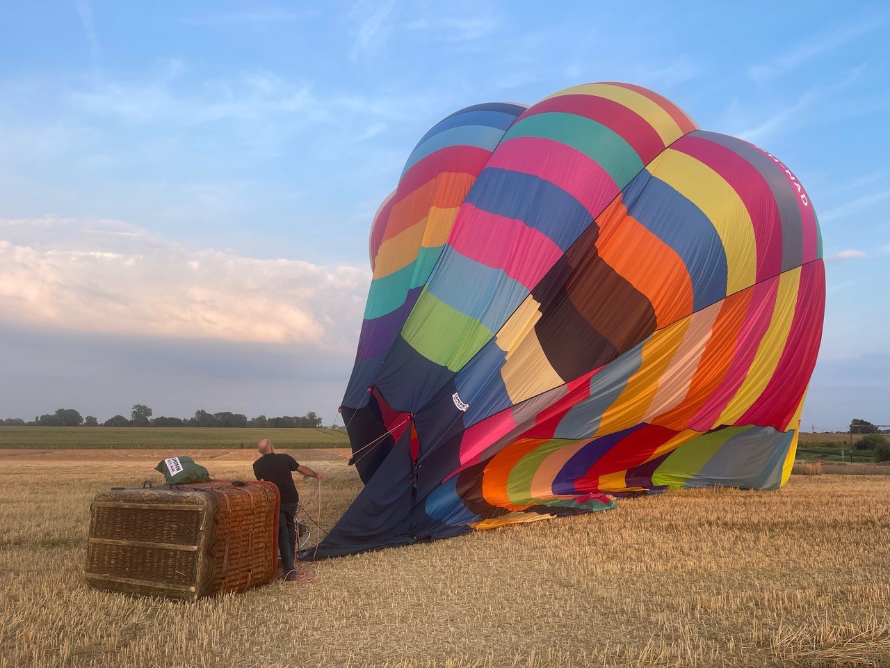 Preparing a colourful hot air balloon with the crew